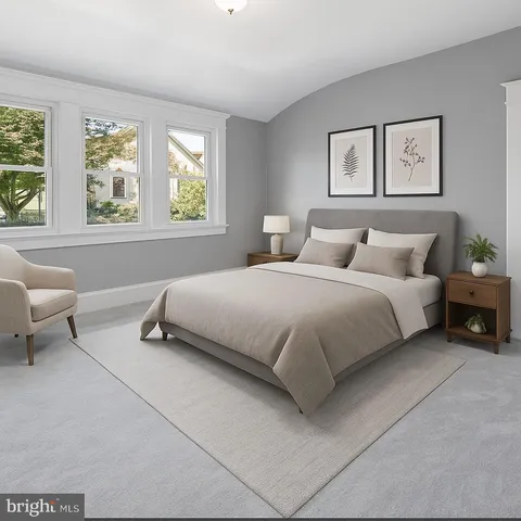 a bedroom with bed and a couch