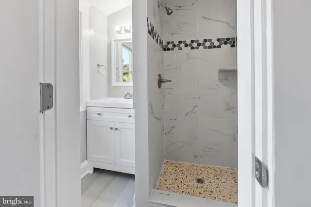 a view of a house with a big yard and large trees