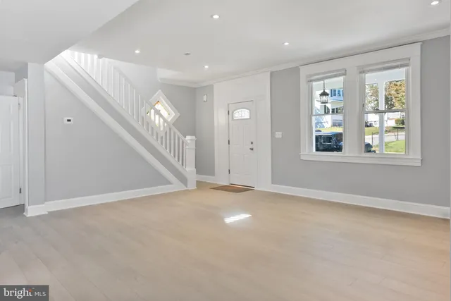 a kitchen with stainless steel appliances granite countertop a refrigerator a stove a sink and a microwave