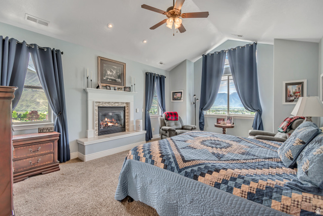 2543 East 700 South Springville, UT 84663 - Photo 42 of 73 Carpeted bedroom featuring ceiling fan and a glass covered fireplace