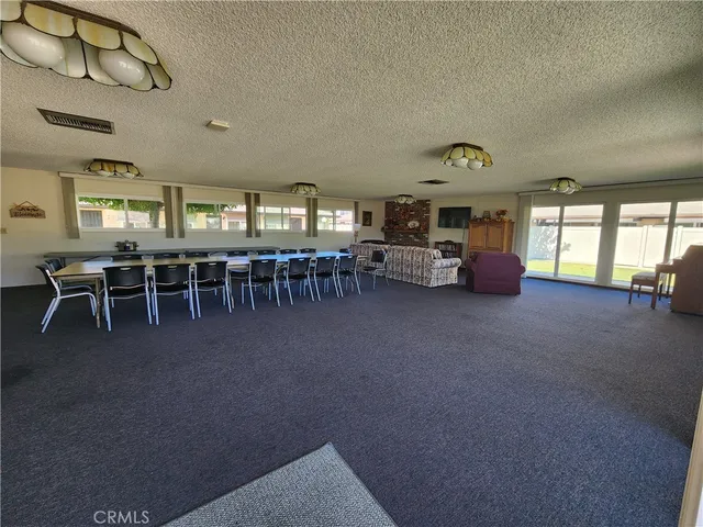 a kitchen with refrigerator and cabinets