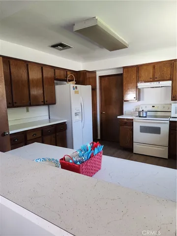 a picture of a bathroom with a window and a potted plant