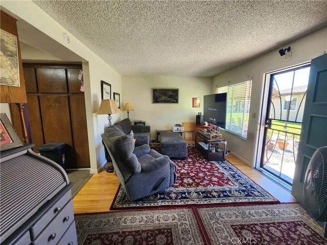 a living room with furniture rug and window