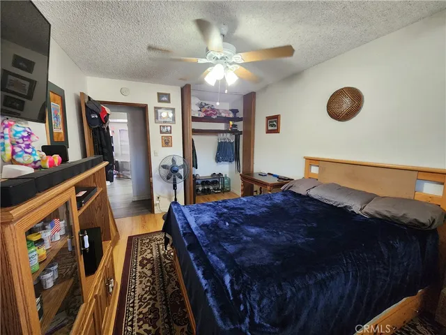 a bed room with a bed and a chandelier