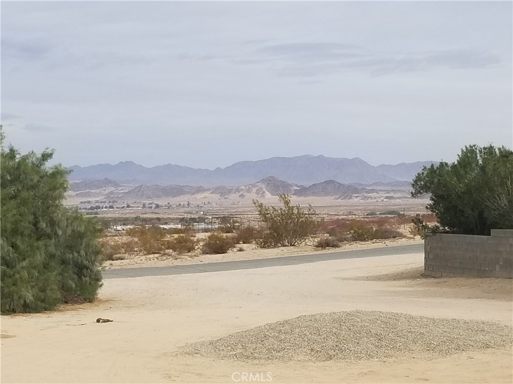 73550 2 Mile Road, Unit 11 Twentynine Palms, CA 92277 - Photo 1 of 7 a view of an ocean and a mountain