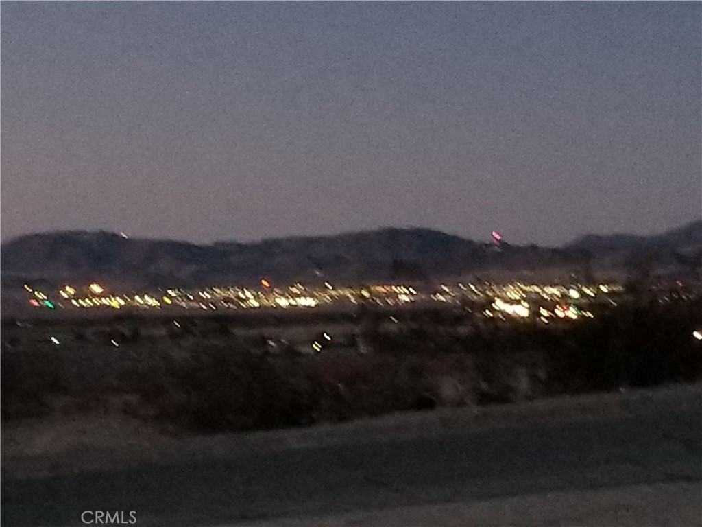 73550 2 Mile Road, Unit 11 Twentynine Palms, CA 92277 - Photo 2 of 7 a view of a house and a yard
