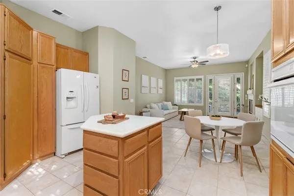 a kitchen that has a table and chairs in it