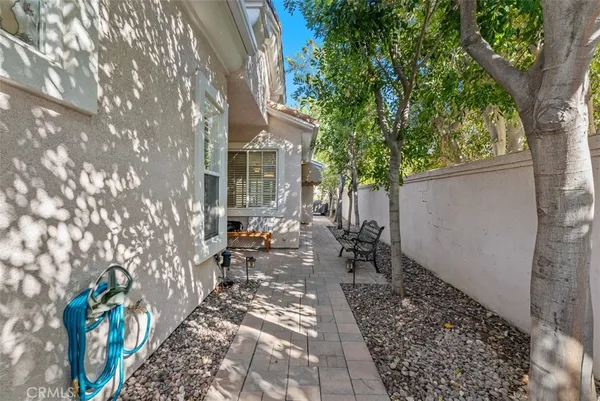 a view of a chairs and table in a patio