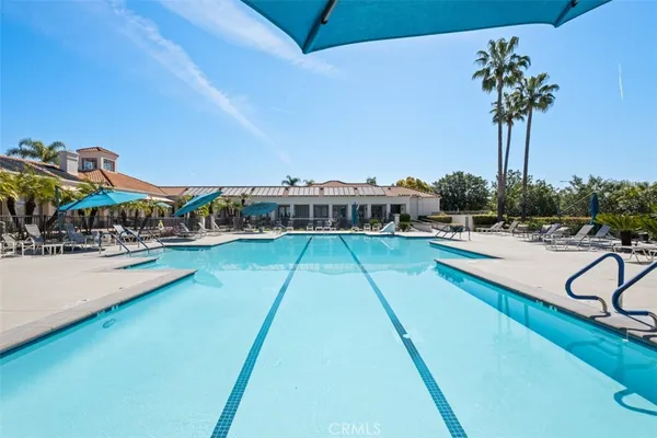 a view of a swimming pool with a table and chairs