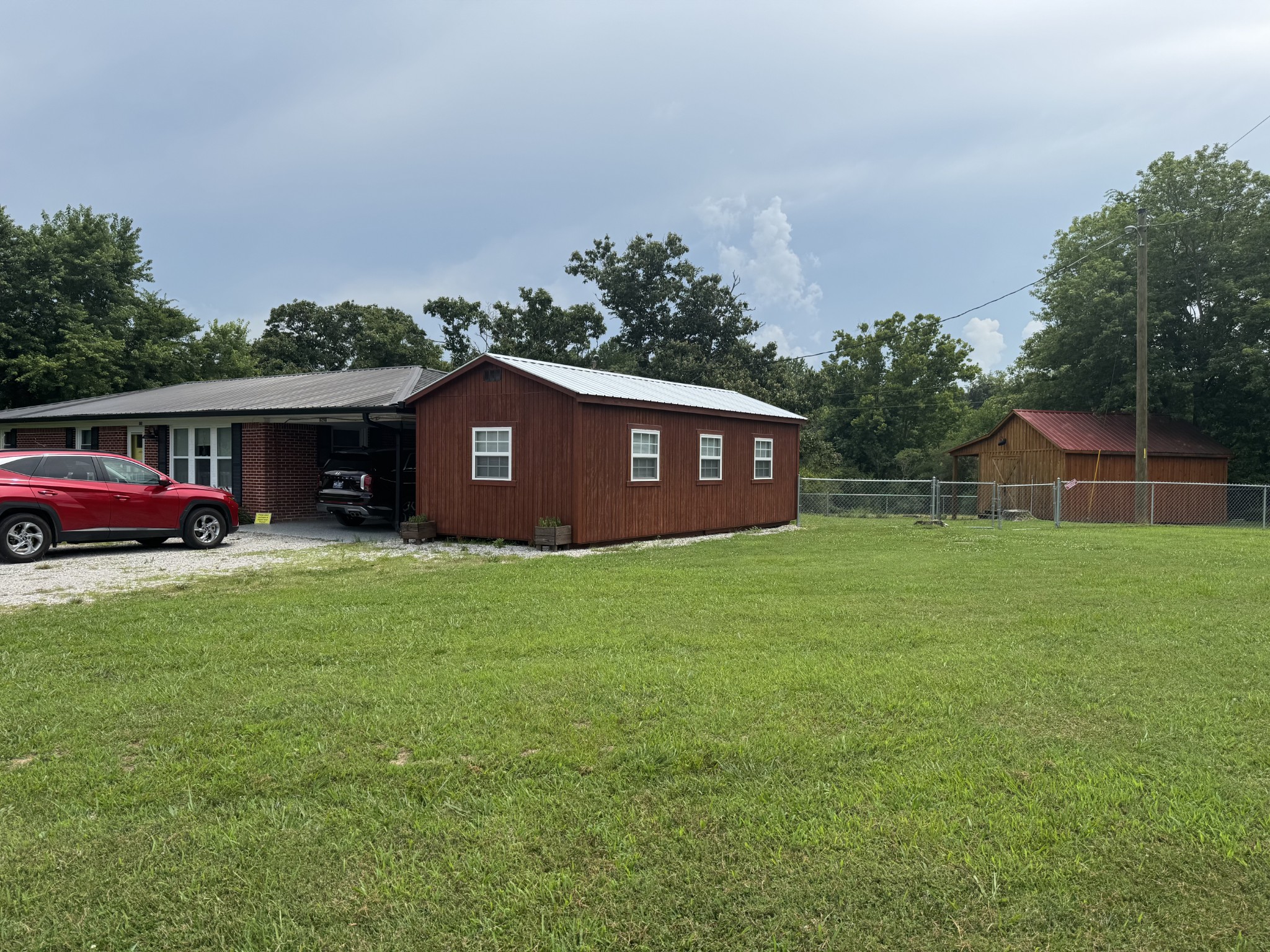 8298 Southfork Road Baxter, TN 38544 - Photo 12 of 49 a view of a house with a garden and yard