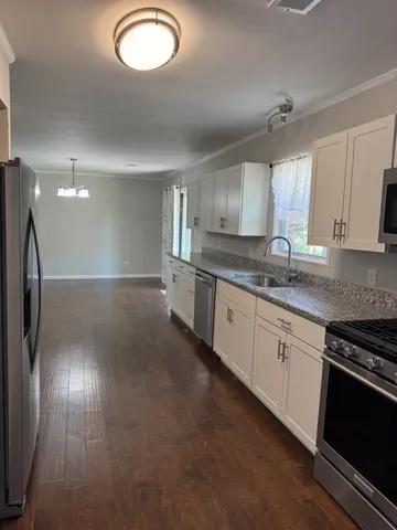 a large kitchen with cabinets