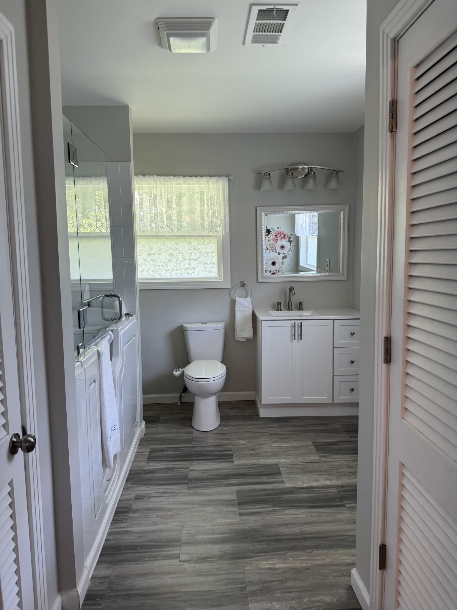 8298 Southfork Road Baxter, TN 38544 - Photo 32 of 49 a spacious bathroom with a sink a toilet and a window