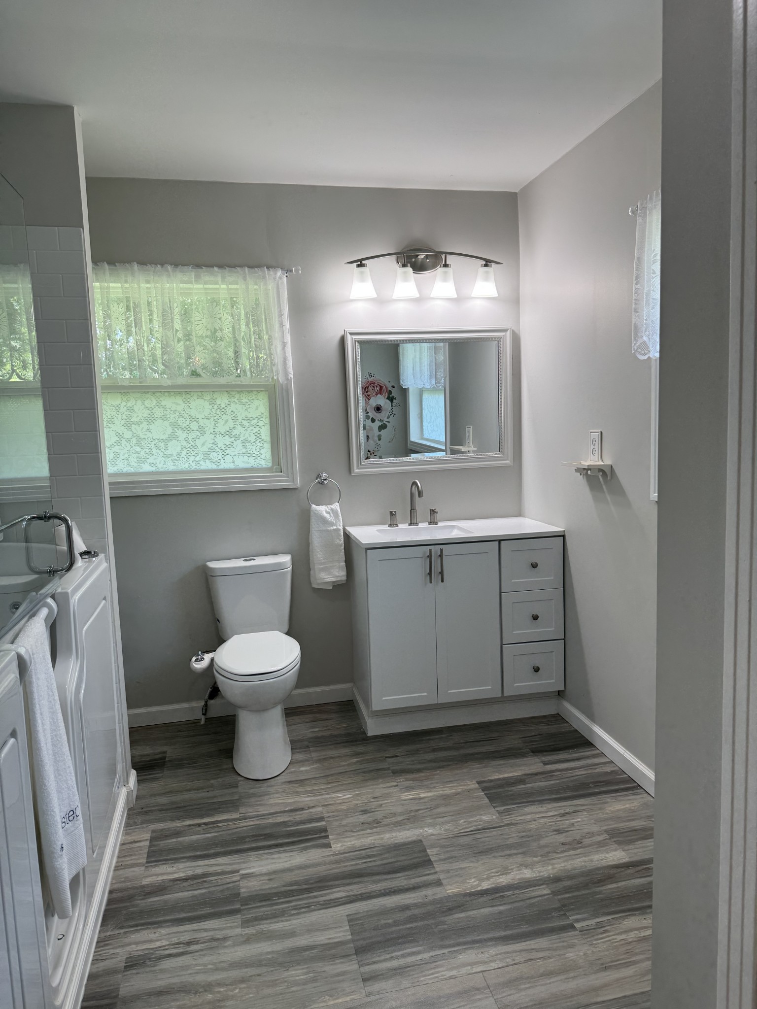 8298 Southfork Road Baxter, TN 38544 - Photo 33 of 49 a bathroom with a sink toilet and mirror