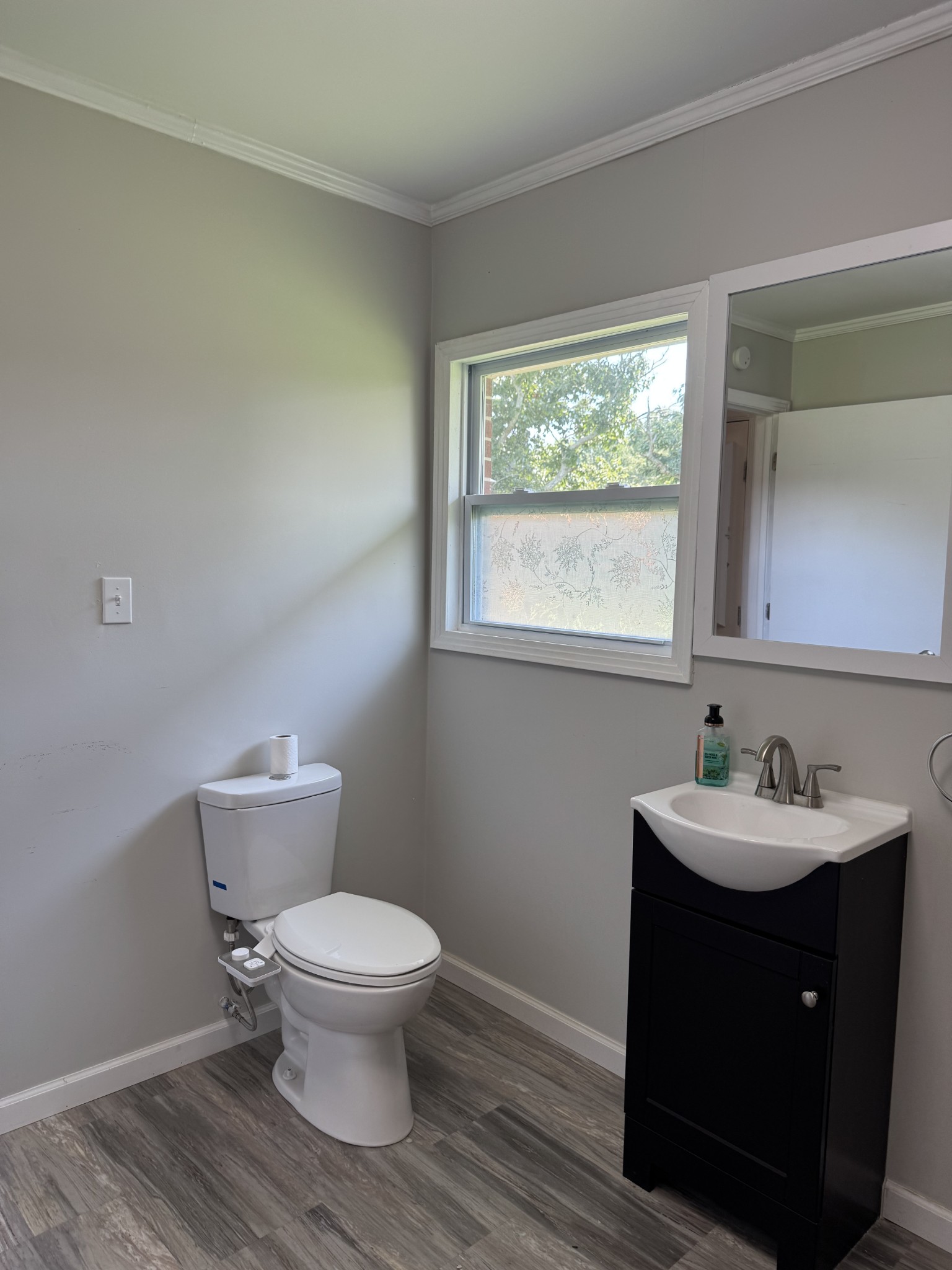 8298 Southfork Road Baxter, TN 38544 - Photo 41 of 49 a bathroom with a toilet a sink and a window