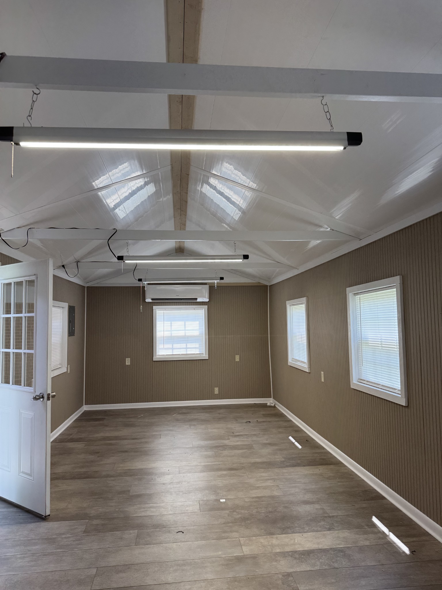 8298 Southfork Road Baxter, TN 38544 - Photo 43 of 49 a view of an empty room with wooden floor and a window