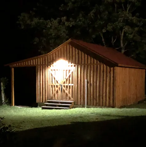 a living room with lots of furniture and lamp