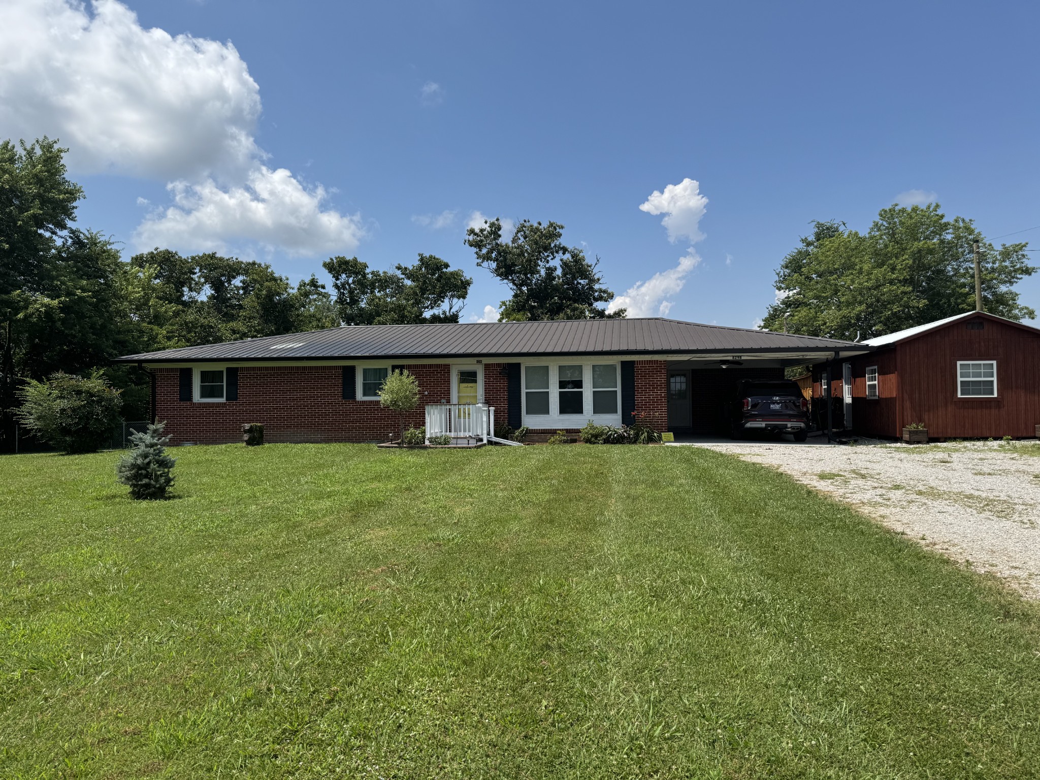 8298 Southfork Road Baxter, TN 38544 - Photo 5 of 49 a front view of a house with a yard and green space