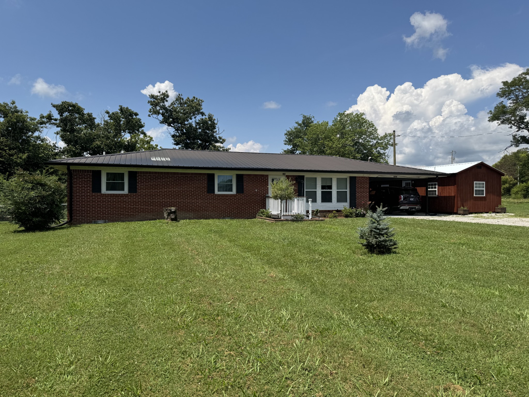8298 Southfork Road Baxter, TN 38544 - Photo 6 of 49 a front view of house with yard and green space