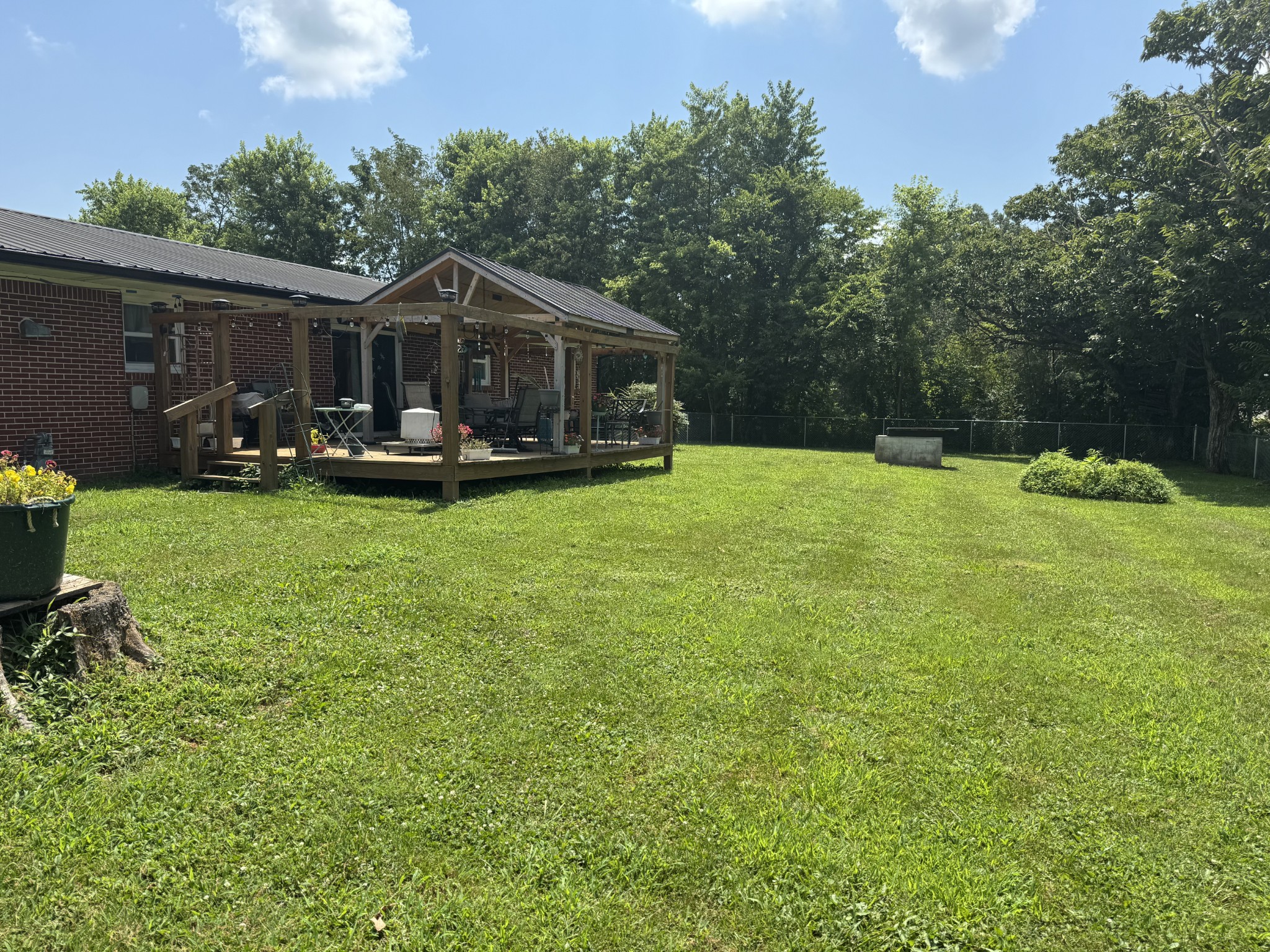 8298 Southfork Road Baxter, TN 38544 - Photo 9 of 49 a front view of a house with garden and sitting area