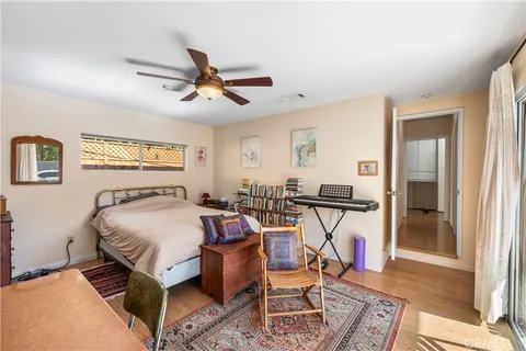 a bedroom with furniture and a window