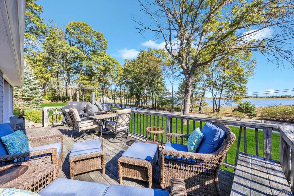 39 Bevin Road Northport, NY 11768 - Photo 5 of 44 Wooden terrace featuring an outdoor living space, a yard, and a water view