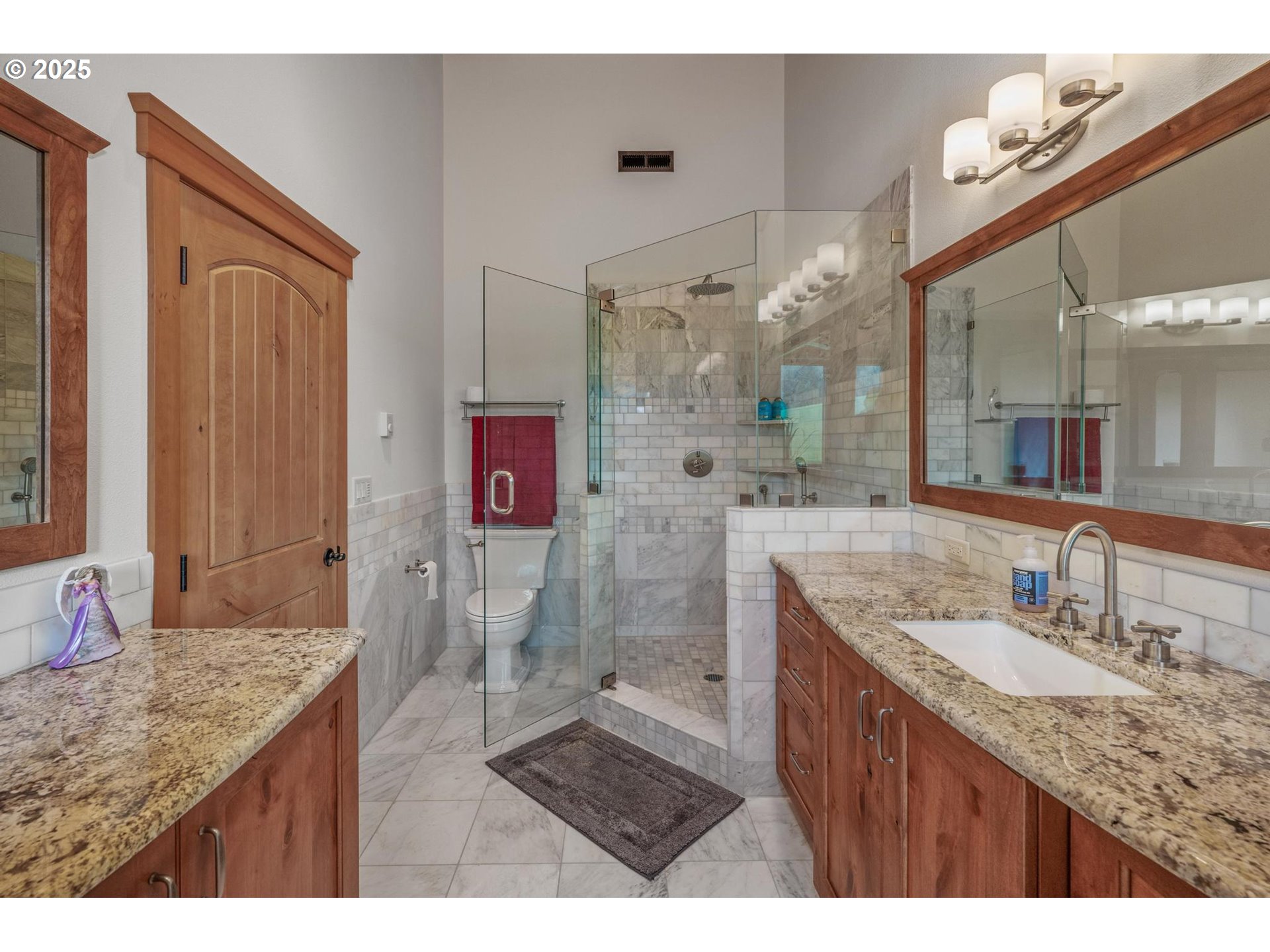61612 Fays Lane St. Helens, OR 97051 - Photo 23 of 37 a bathroom with a granite countertop sink a mirror and a shower