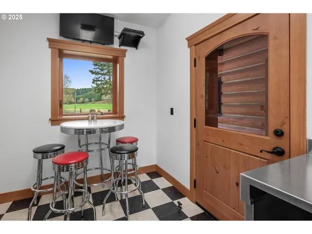 a front view of a house with a yard table and chairs