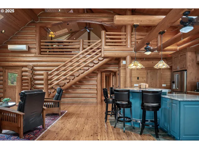 a dining table with chairs and wooden floor