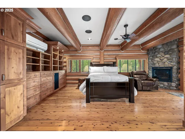 a bedroom with a bed window and a table