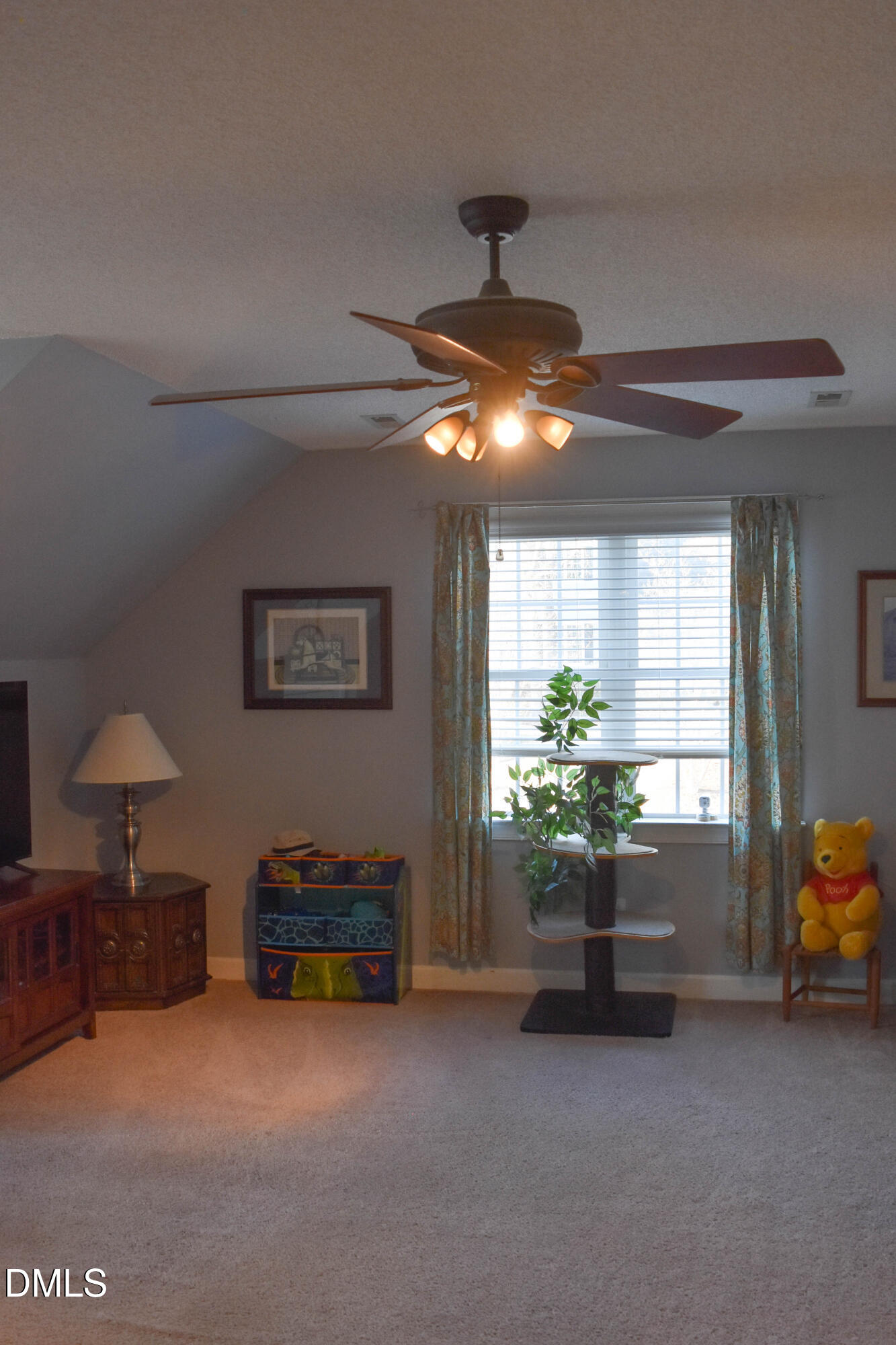 5908 Deep Spring Circle Wake Forest, NC 27587 - Photo 27 of 51 a living room with furniture and a chandelier