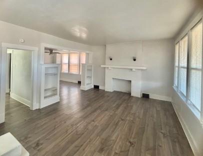 2992 Ruthwood Avenue Pittsburgh, PA 15227 - Photo 4 of 11 an empty room with wooden floor cabinet and windows