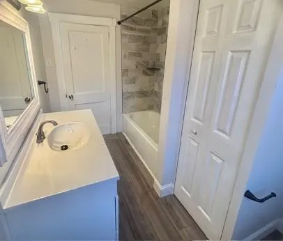 a bathroom with a tub and a sink