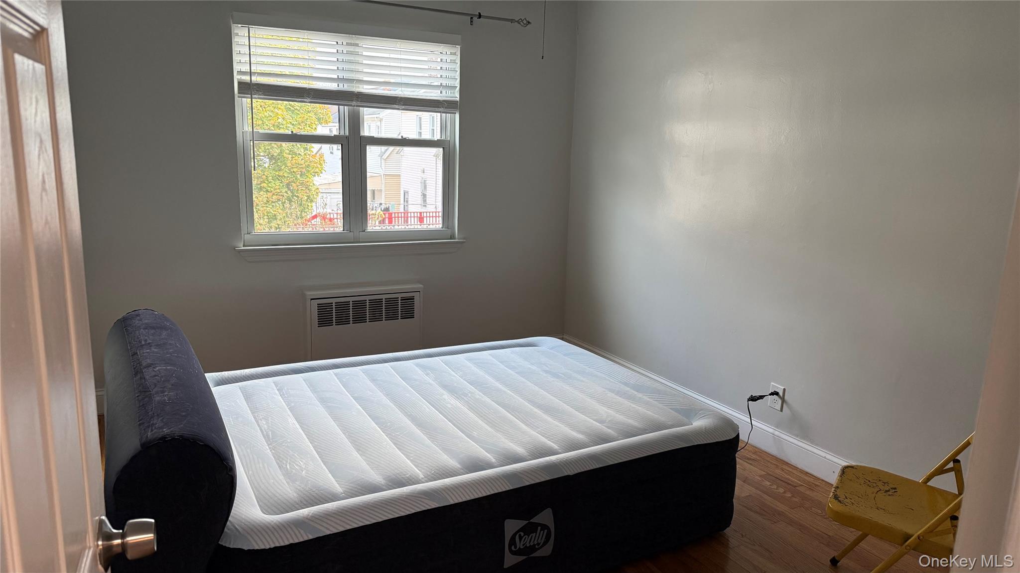 215-10 Hillside Avenue, Unit 1 Queens, NY 11427 - Photo 3 of 8 a view of a room with a window