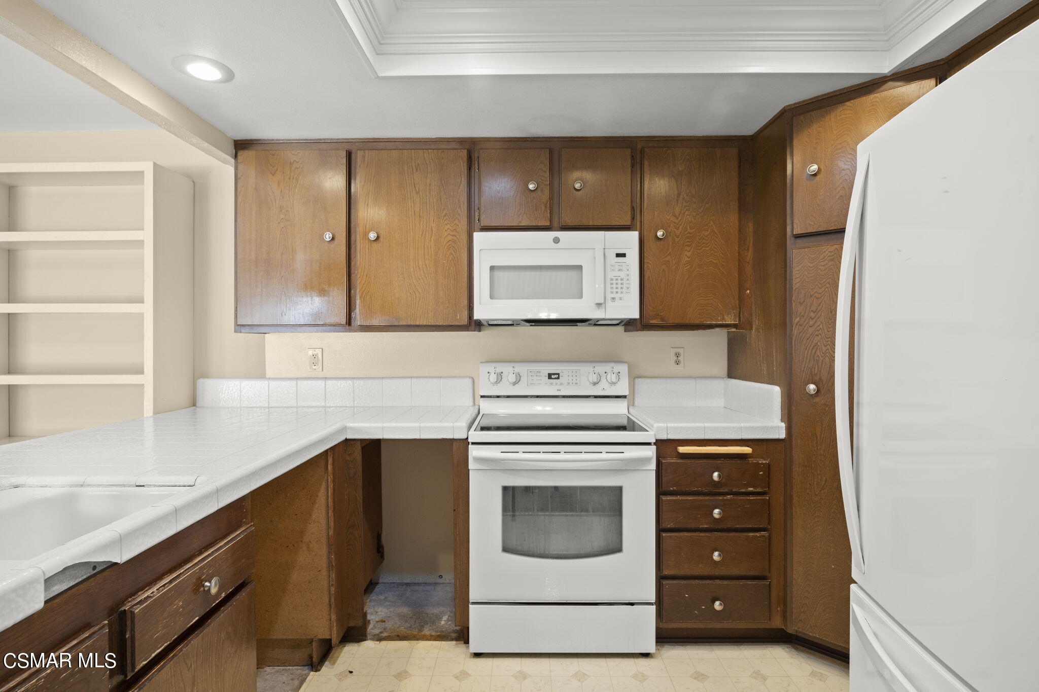 3601 Ketch Avenue Oxnard, CA 93035 - Photo 16 of 37 a kitchen with a stove and a sink