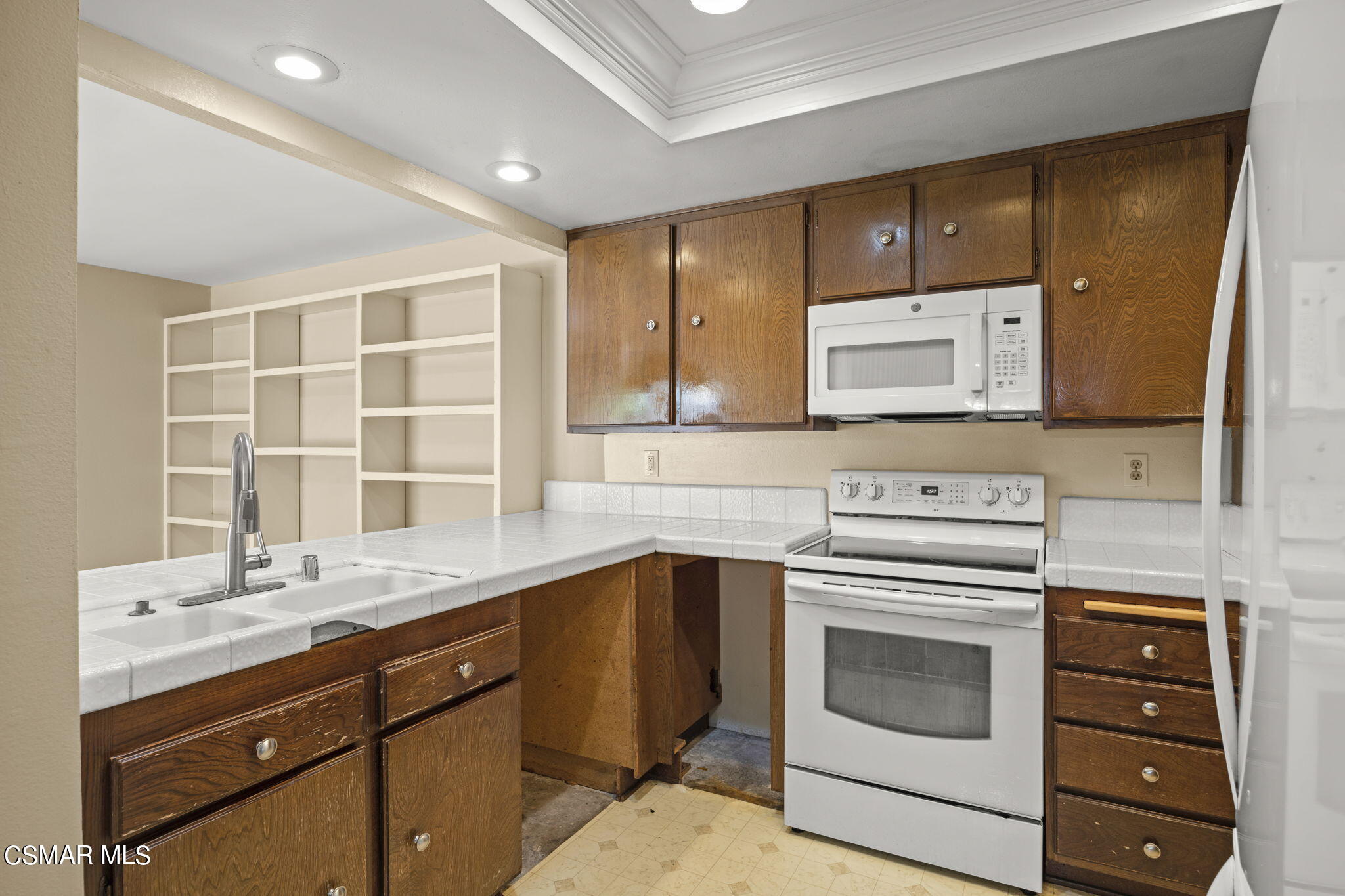 3601 Ketch Avenue Oxnard, CA 93035 - Photo 17 of 37 a kitchen with a stove microwave and sink
