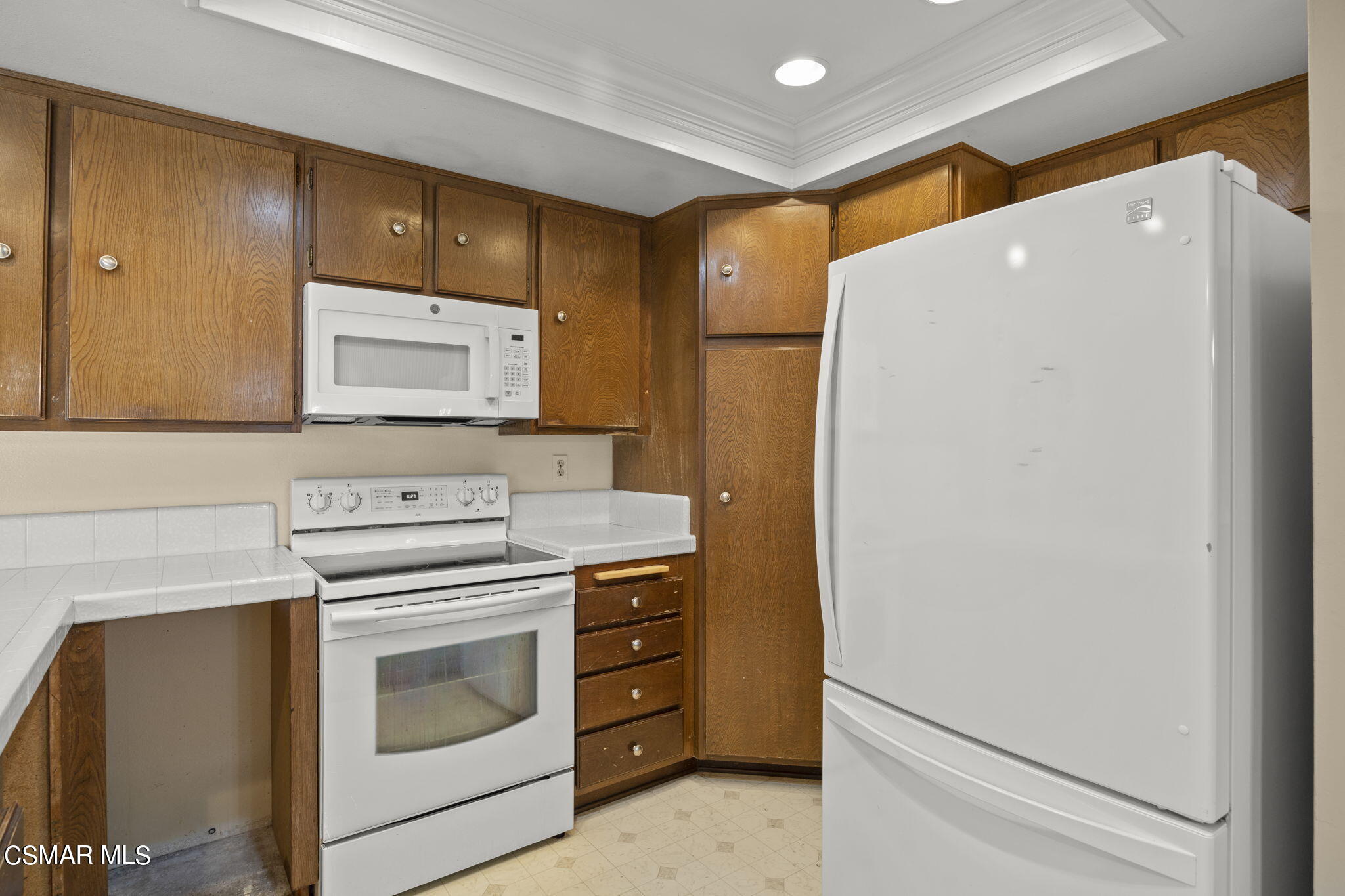 3601 Ketch Avenue Oxnard, CA 93035 - Photo 18 of 37 a kitchen with a stove and a refrigerator