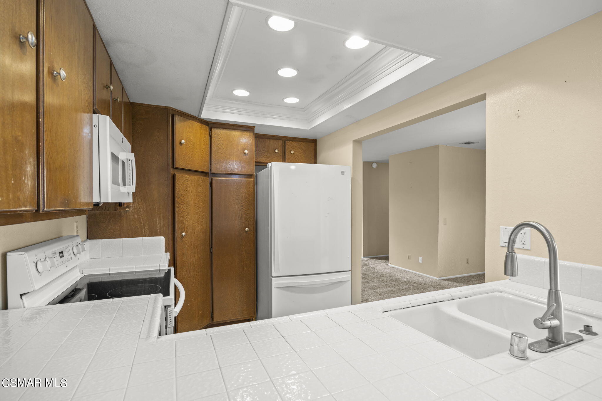 3601 Ketch Avenue Oxnard, CA 93035 - Photo 19 of 37 a kitchen with a refrigerator and a sink