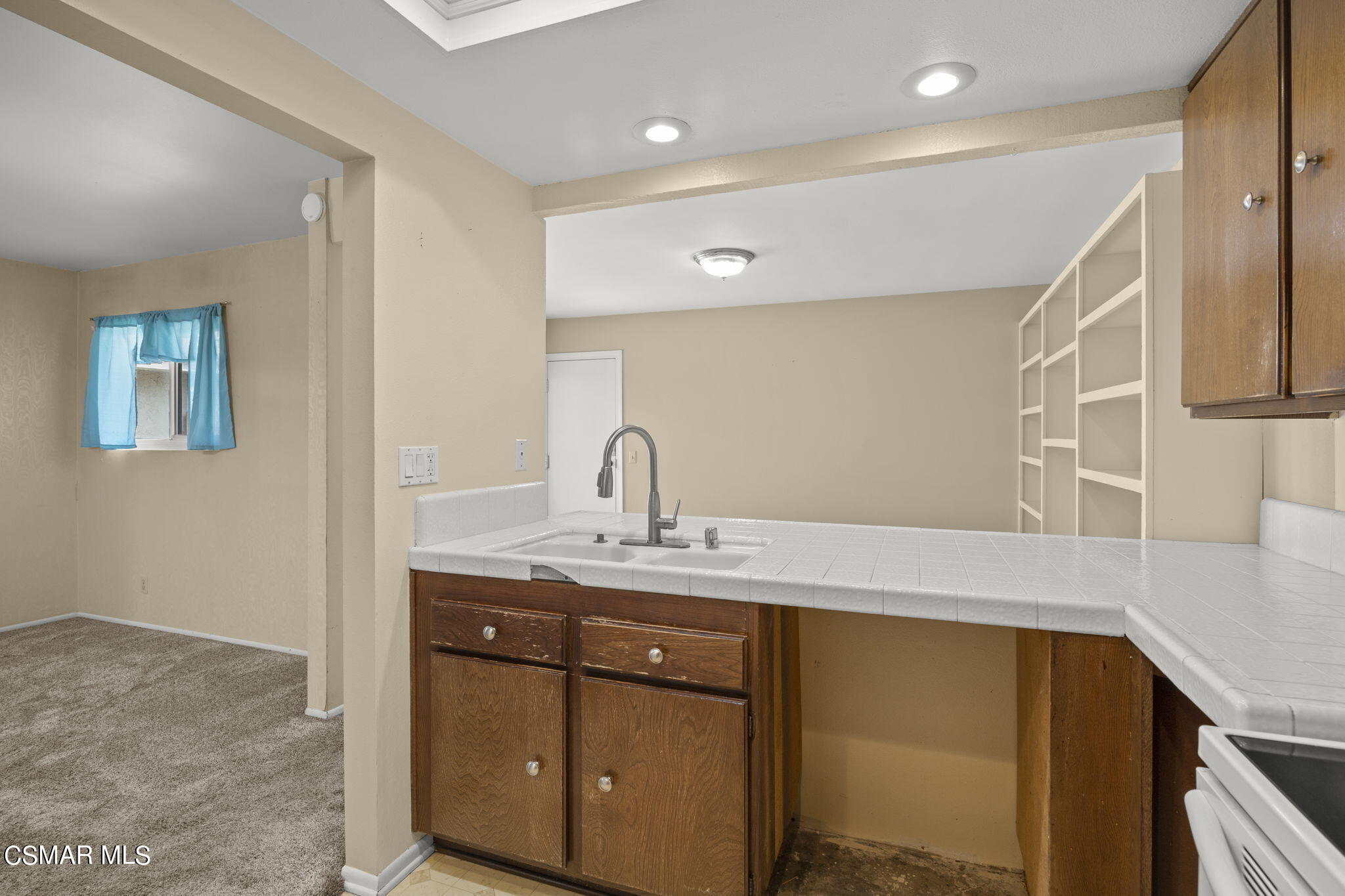 3601 Ketch Avenue Oxnard, CA 93035 - Photo 20 of 37 a kitchen with a sink and a mirror