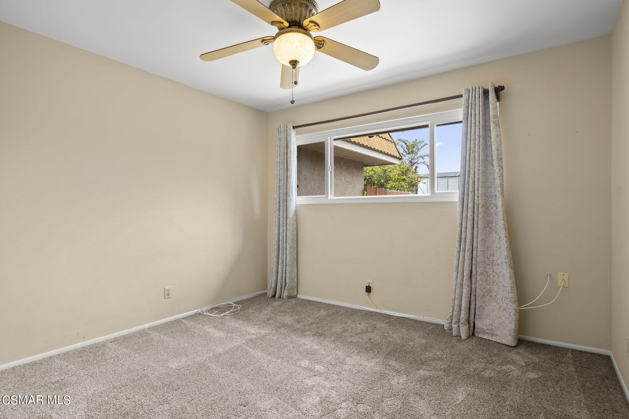 3601 Ketch Avenue Oxnard, CA 93035 - Photo 27 of 37 an empty room with a window and a ceiling fan