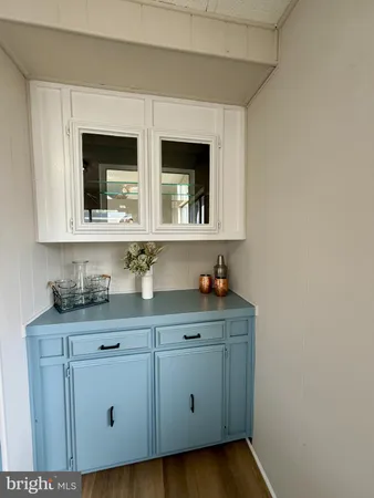 a kitchen with sink and cabinets