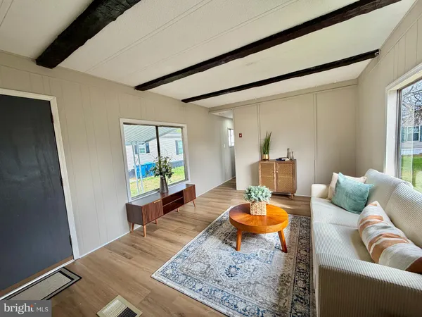 a living room with furniture and a rug