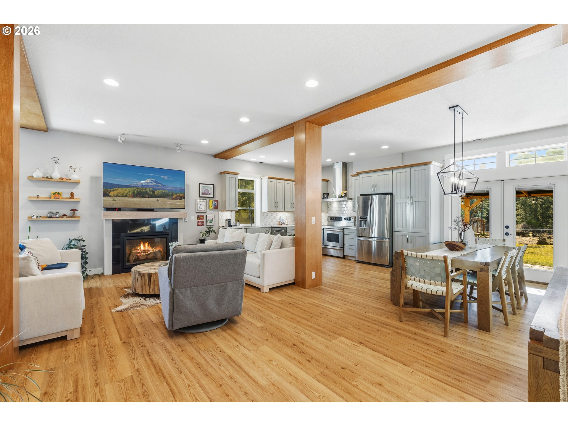 4 Westside Road Trout Lake, WA 98650 - Photo 11 of 45 a living room with furniture wooden floor and a fireplace