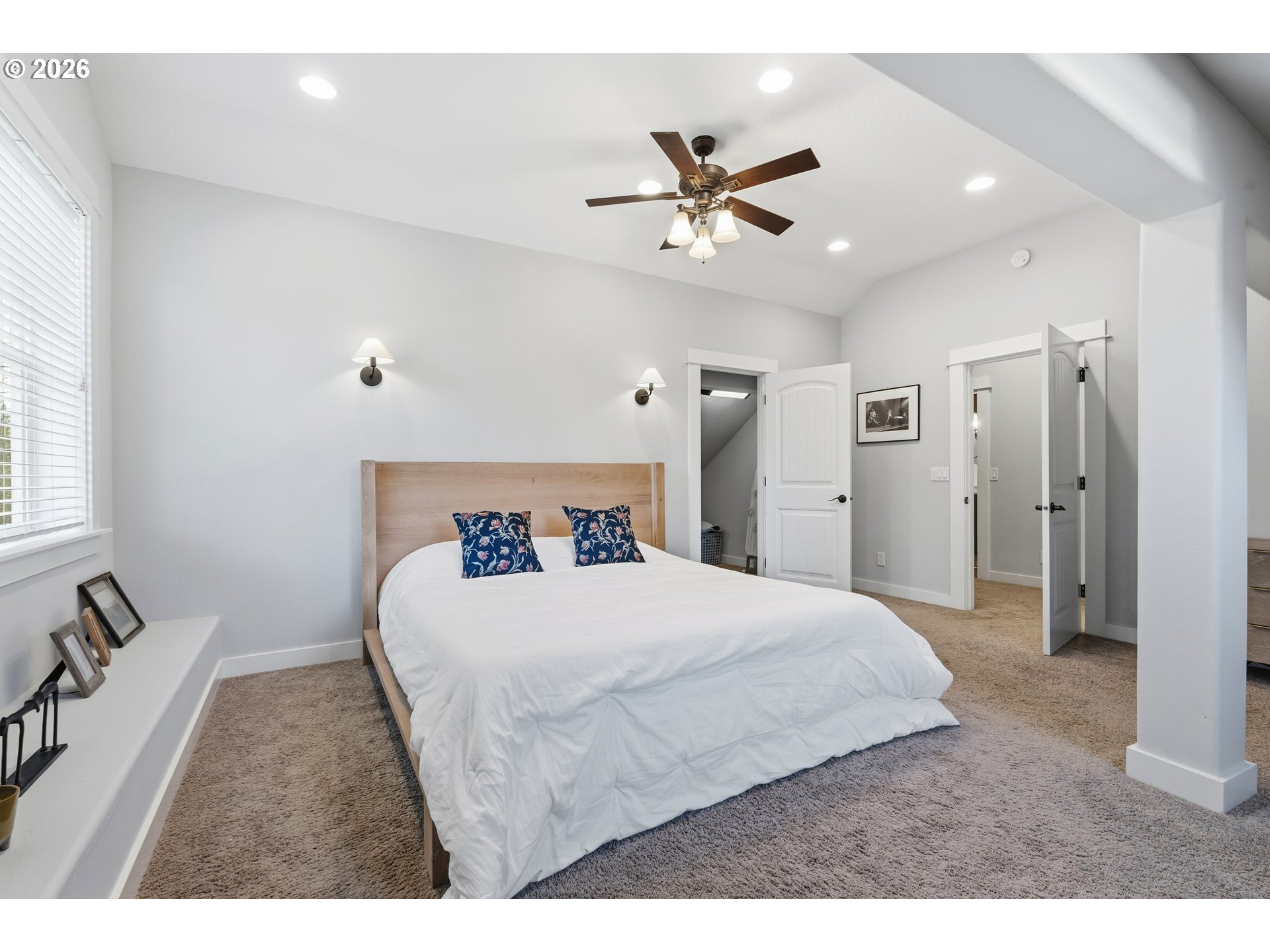 4 Westside Road Trout Lake, WA 98650 - Photo 18 of 45 a bedroom with a bed and a chandelier