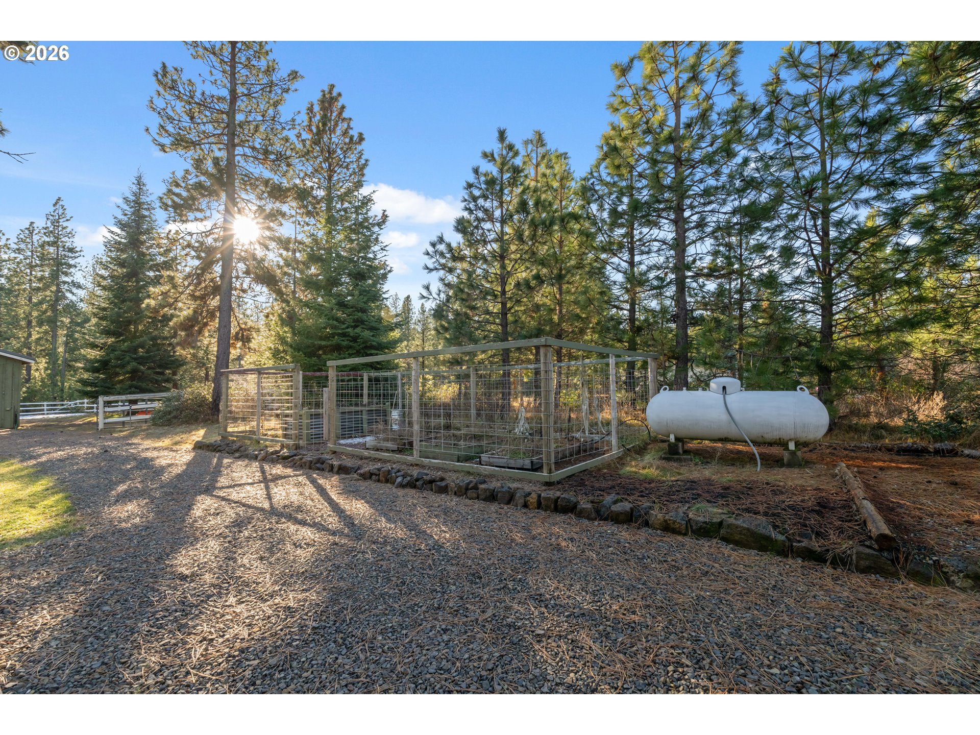 4 Westside Road Trout Lake, WA 98650 - Photo 32 of 45 a backyard of a house with table and chairs