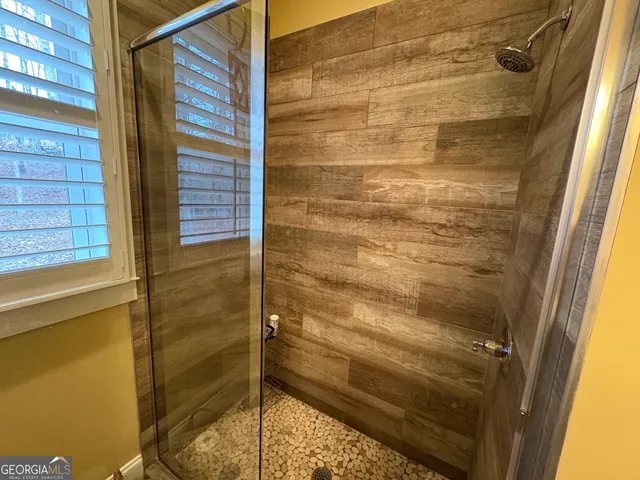 a bed room with bed and a window