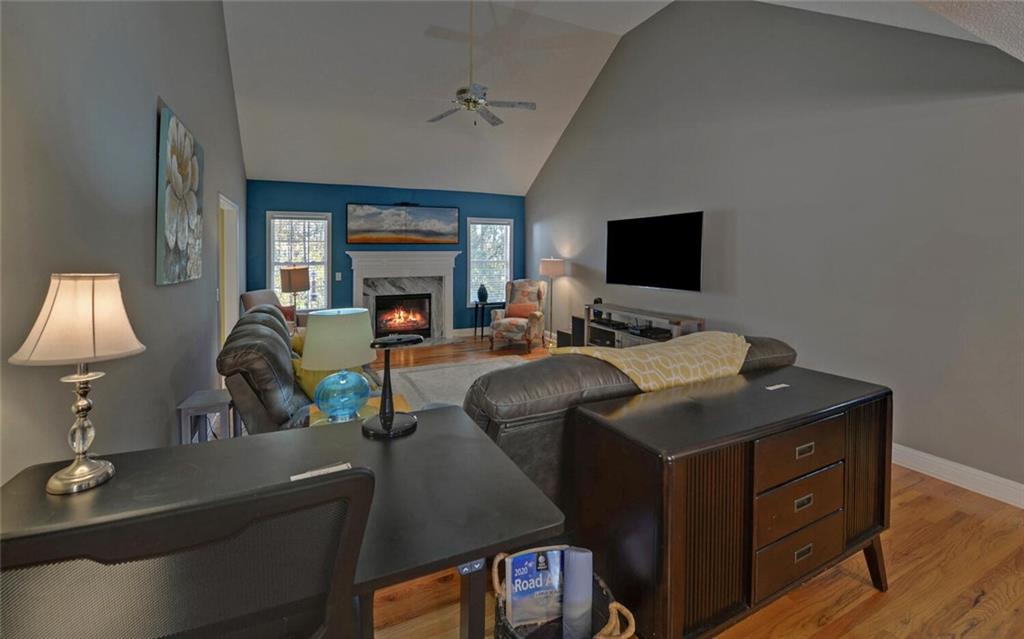 3644 Maple Forge Lane Gainesville, GA 30504 - Photo 19 of 49 a living room with furniture and a flat screen tv