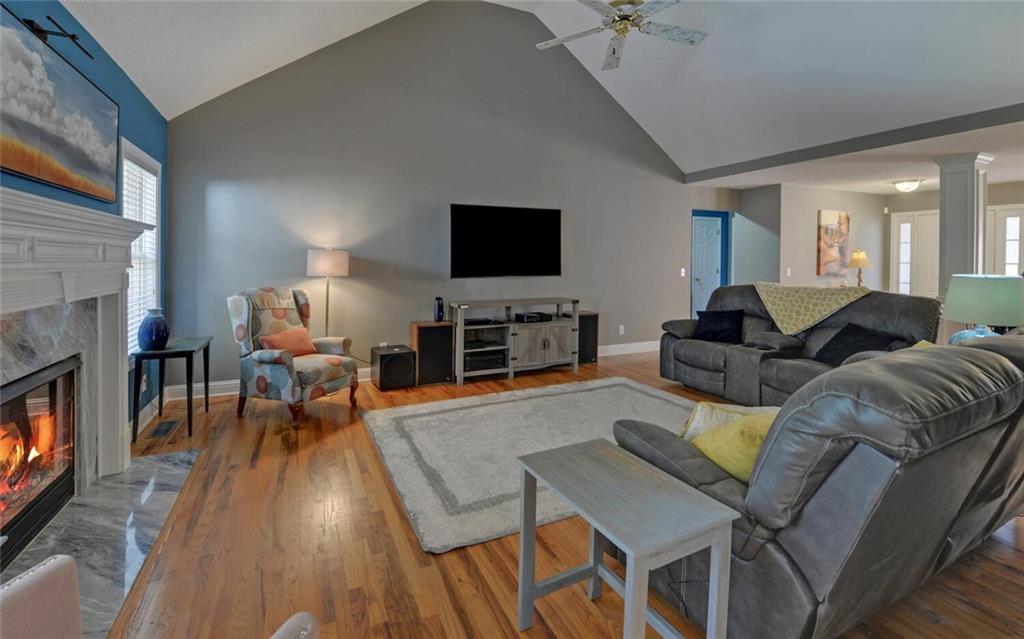 3644 Maple Forge Lane Gainesville, GA 30504 - Photo 20 of 49 a living room with furniture a flat screen tv and a fireplace