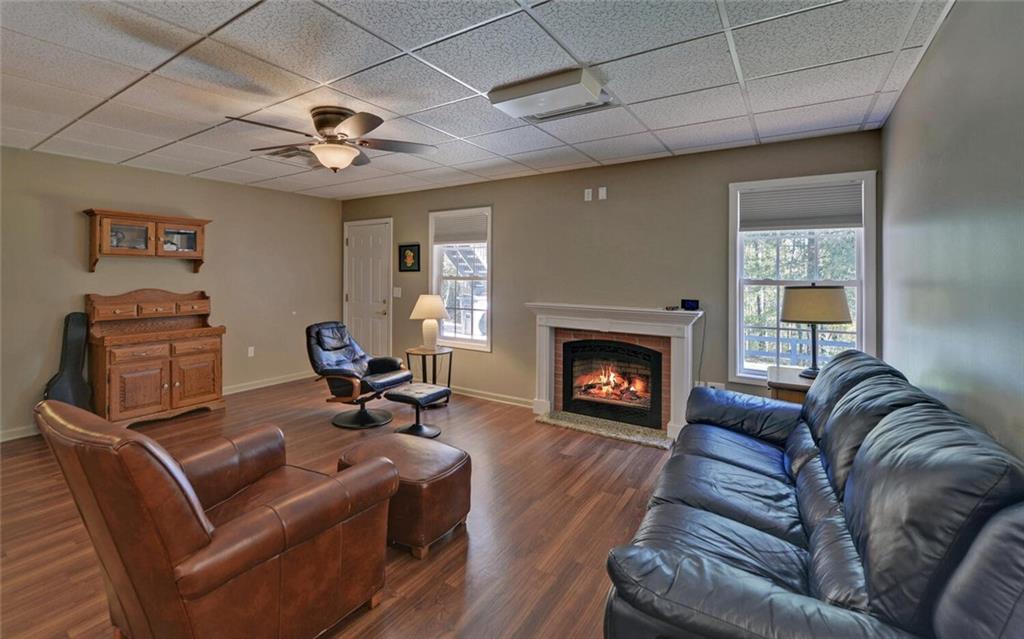 3644 Maple Forge Lane Gainesville, GA 30504 - Photo 22 of 49 a living room with furniture and a fireplace