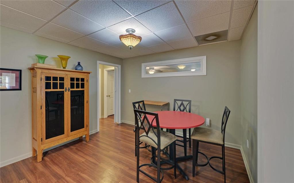 3644 Maple Forge Lane Gainesville, GA 30504 - Photo 25 of 49 a view of a dining room with furniture and wooden floor