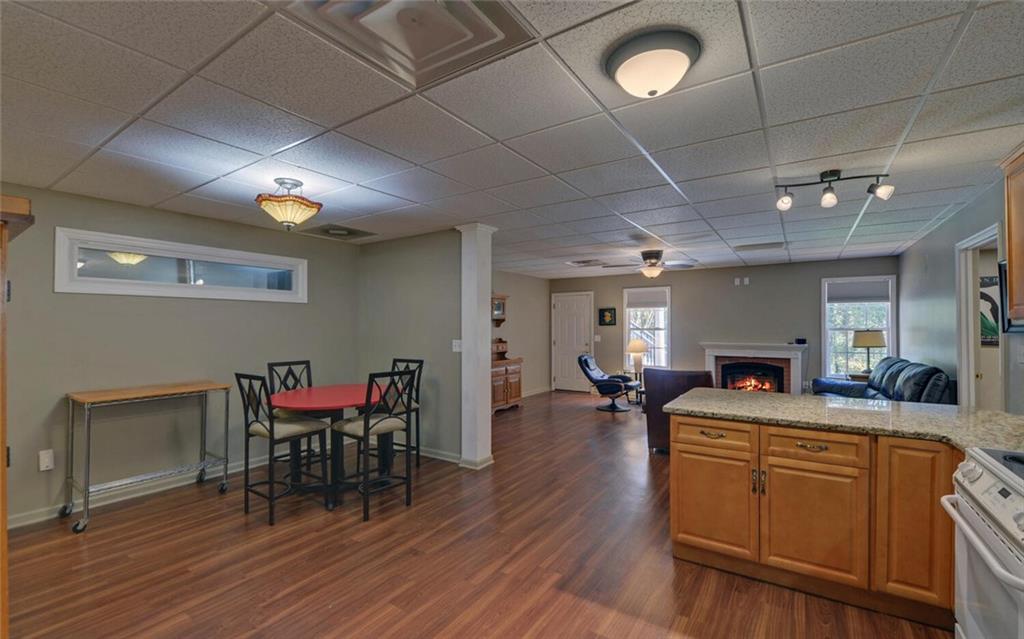 3644 Maple Forge Lane Gainesville, GA 30504 - Photo 26 of 49 a view of a dining room with furniture and wooden floor